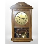 A Junghans oak cased wall clock,