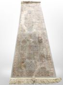 A machine made Persian style runner with silk pile,