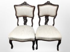 A pair of Victorian carved mahogany salon chairs