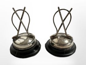 Two Edwardian weighted silver golf trophies, Birmingham 1906, height 5cm.