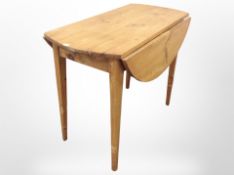A 19th century pine drop leaf table,