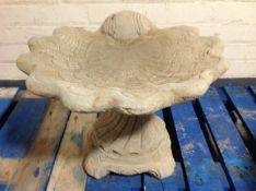 A concrete shell bird bath, height 39cm.