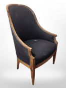 A 19th century mahogany armchair in black upholstery,