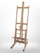 A pair of early 20th century pine artist's easels,