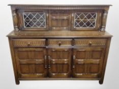 An Ercol stained elm buffet sideboard,