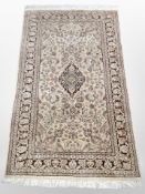 A silk piled Indian rug,