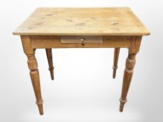 A 19th century pine side table fitted a drawer,