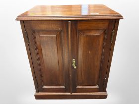 A Victorian mahogany double door cabinet,