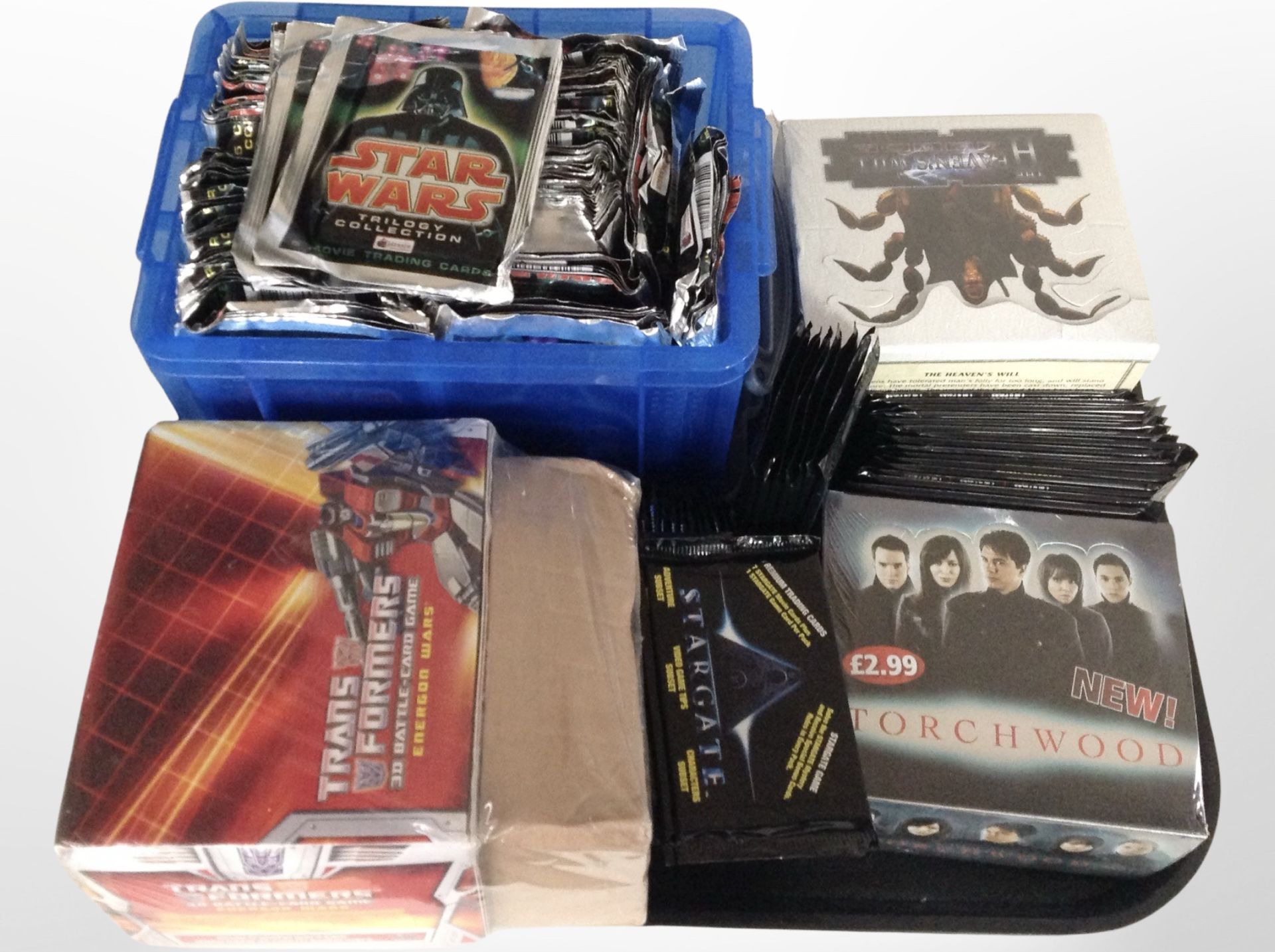 A group of trading cards : Star Wars , Torchwood, Transformers, etc.
