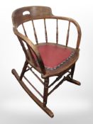 A 19th century oak spindle back rocking chair,