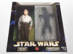 A Kenner Collection Star Wars figurine, Han Solo as Prisoner, and Han Solo in Carbonite Block,