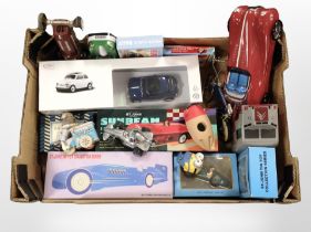 A group of tin-plate wind-up toys, including Blue Bird Record Racer, tins in the form of cars, etc.