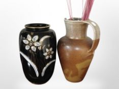 A glazed earthenware jug, height 33cm,
