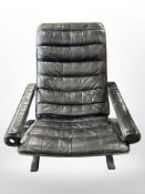 A 20th century Scandinavian bentwood and black stitched leather armchair,