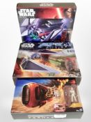 Three Hasbro Star Wars models, Tie Striker, Tie Fighter, and Rey's Speeder (Jakku).