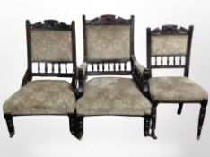 A group of four matching Victorian carved mahogany salon chairs