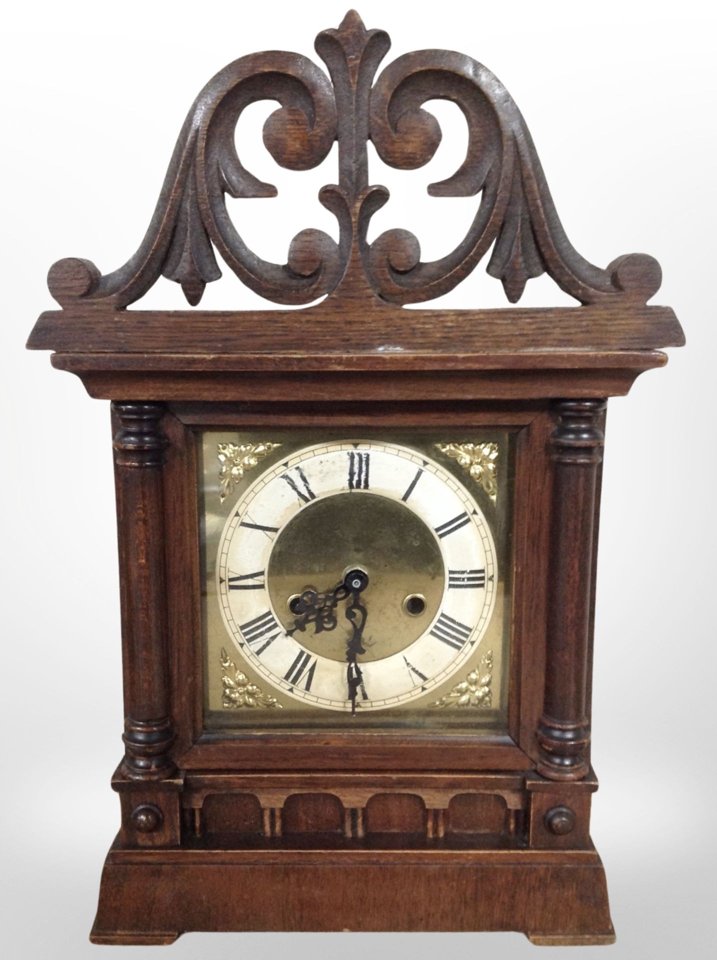 A late Victorian carved oak mantel clock case with later battery movement, height 42cm.