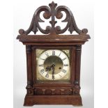 A late Victorian carved oak mantel clock case with later battery movement, height 42cm.