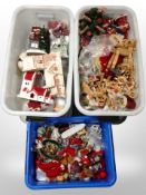 Three boxes of assorted Christmas decorations.