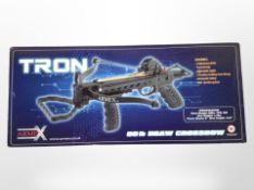 An Armex Tron 80-pound draw crossbow in box.