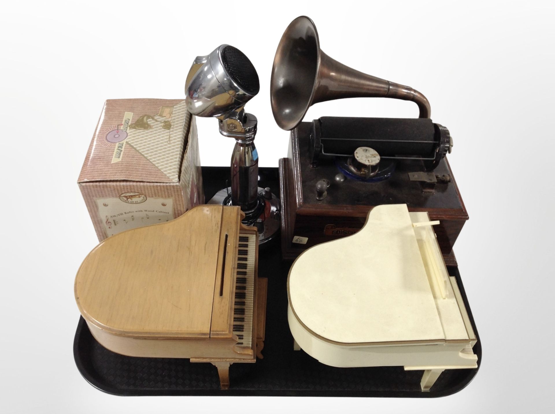 A group of novelty radios, including grand pianos, vintage-style microphone, cylinder gramophone,