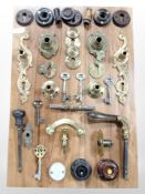 A montage of antique keys, escutcheons and other door furniture, 47cm x 32cm.