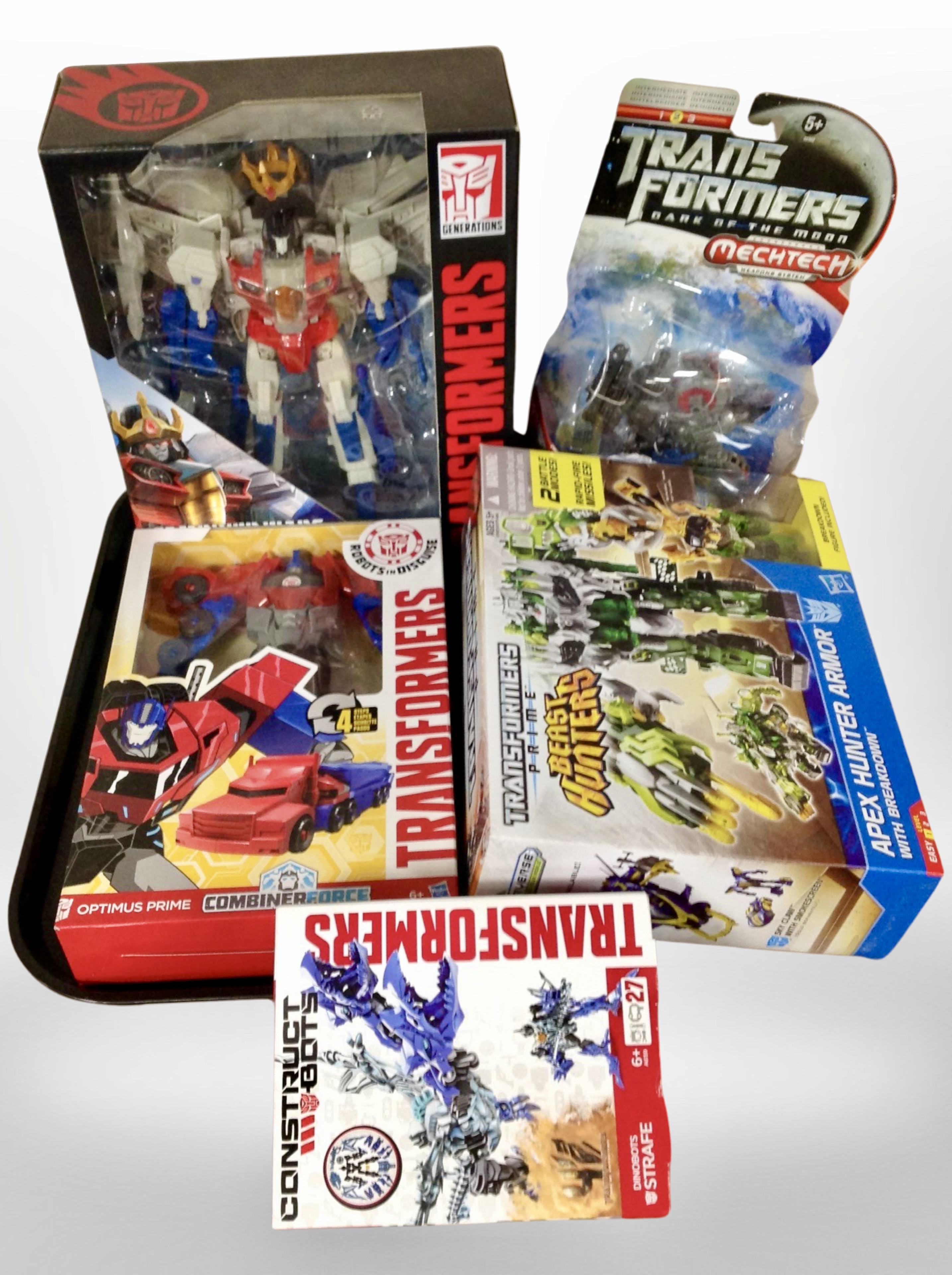 Five Hasbro Transformers figures, boxed.