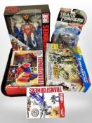 Five Hasbro Transformers figures, boxed.