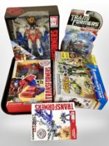 Five Hasbro Transformers figures, boxed.
