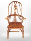A Windsor spindle-back armchair, 64cm wide.