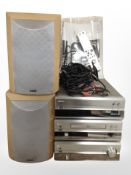 A Denon Hi-Fi with speakers, remotes, and instructions,