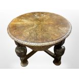 A carved oak circular coffee table on bulbous legs, 80cm diameter, 55cm high.