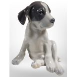 A Royal Copenhagen figure of a seated puppy, height 20cm.