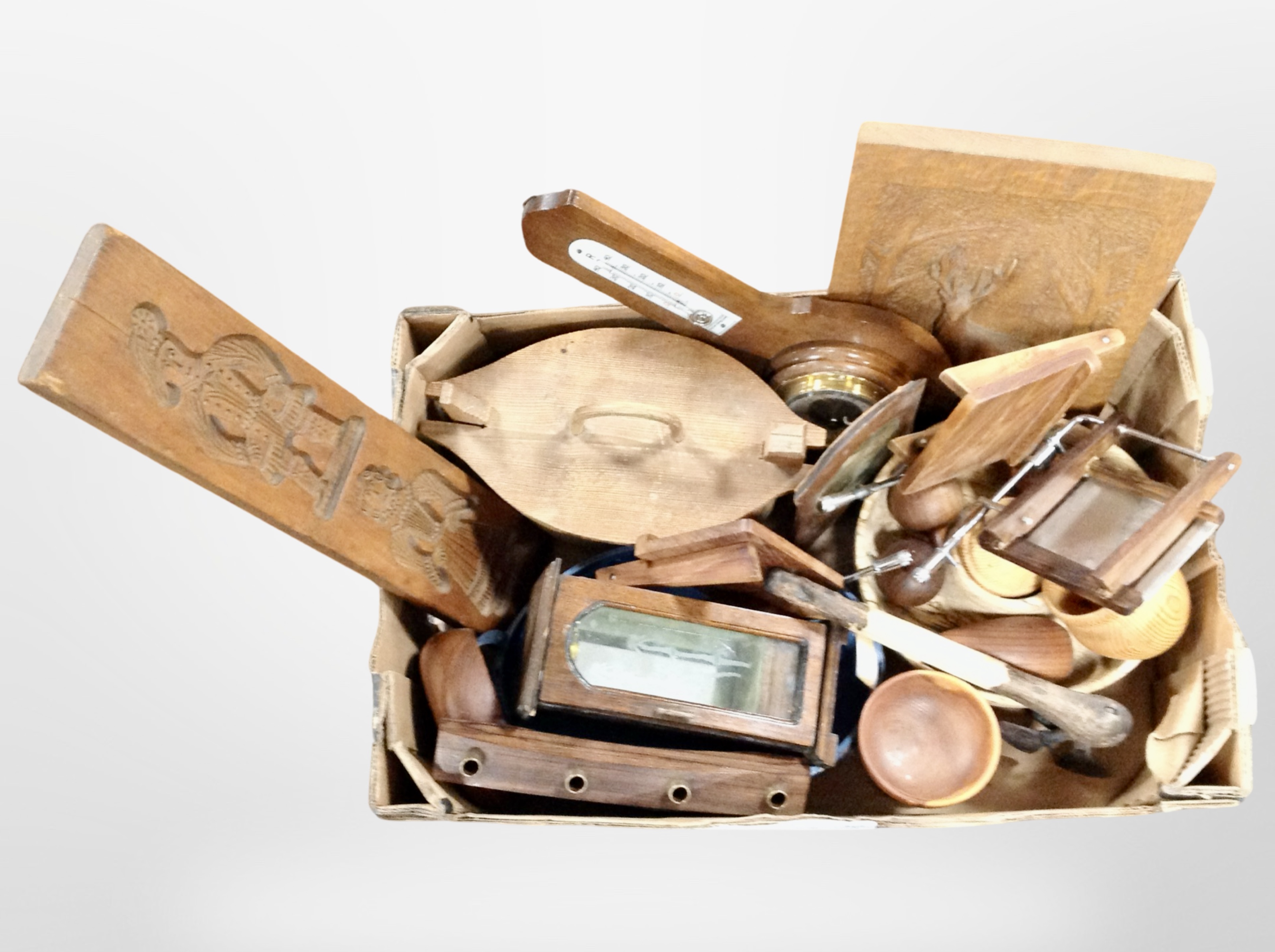 A collection of Scandinavian treen items including gingerbread mould, panels, oak barometer,