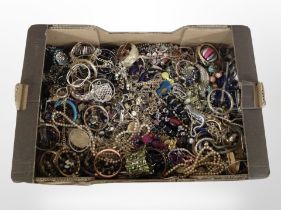 A box of a large quantity of costume necklaces, bangles, faux pearls, etc.