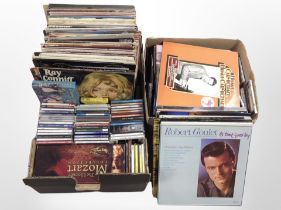 Two boxes containing vinyl LPs and CDs, mixed genres including classical,