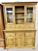 A contemporary oak dresser, 143cm wide x 45cm deep x 201cm high.