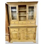 A contemporary oak dresser, 143cm wide x 45cm deep x 201cm high.