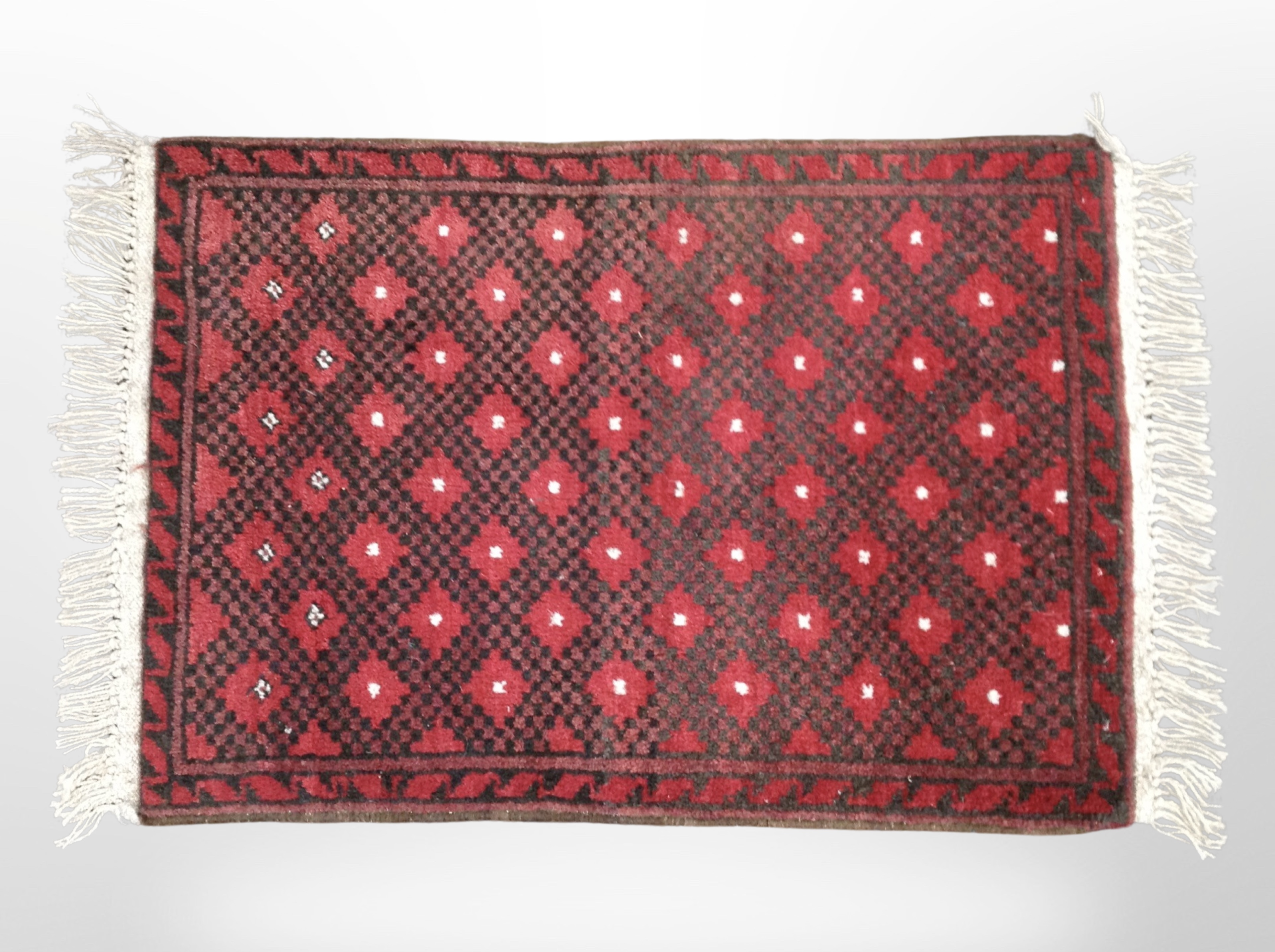 A Balouch rug, Afghanistan, 82cm x 50cm.