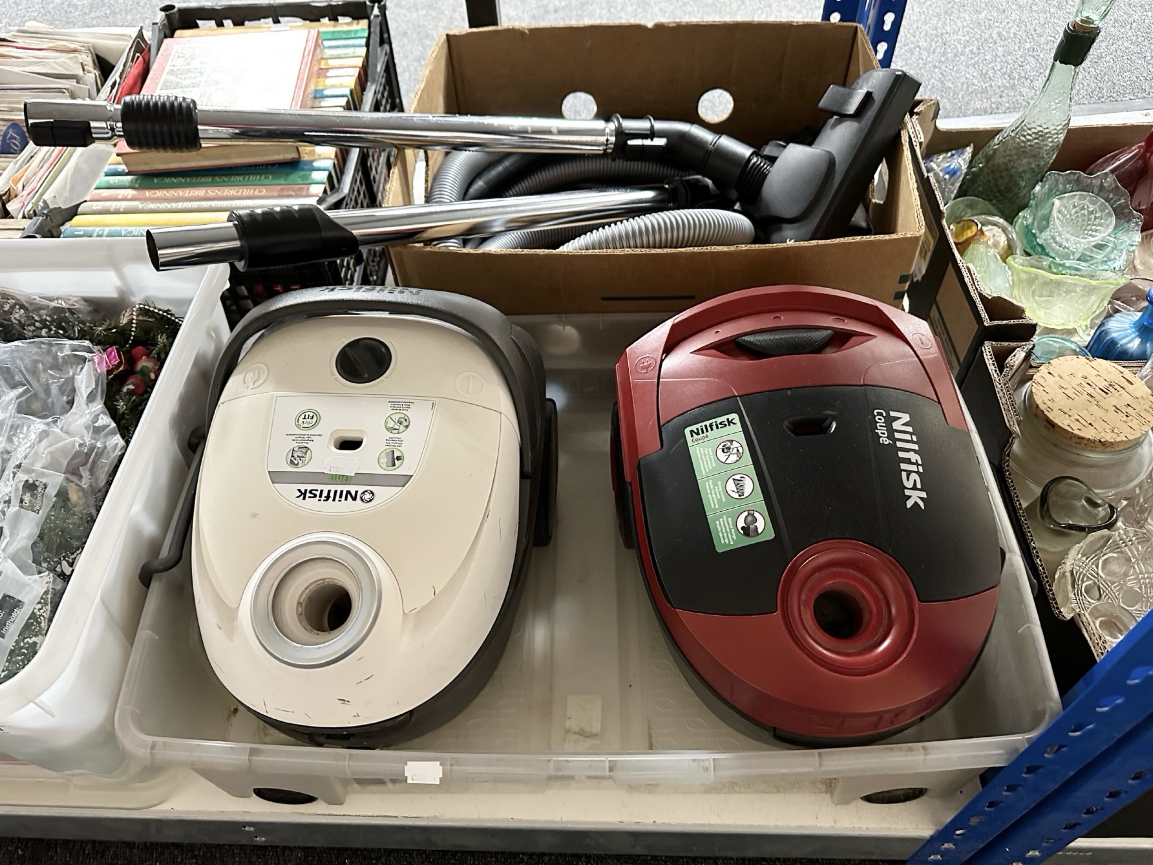 Two Nilfisk vacuum cleaners (continental plugs).