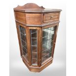 A reproduction mahogany cabinet with leaded glass doors, 56cm wide x 43cm deep x 107cm high.