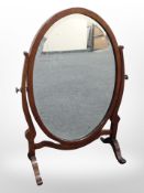 A Victorian mahogany oval dressing table mirror, height 63cm.