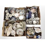 Four boxes containing assorted ceramics including blue and white willow pattern china,