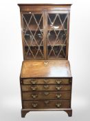 A George III mahogany bureau bookcase, 91cm wide x 52cm deep x 200cm high.