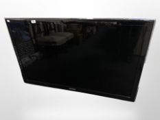 A Samsung 46-inch LCD TV with lead and remote.