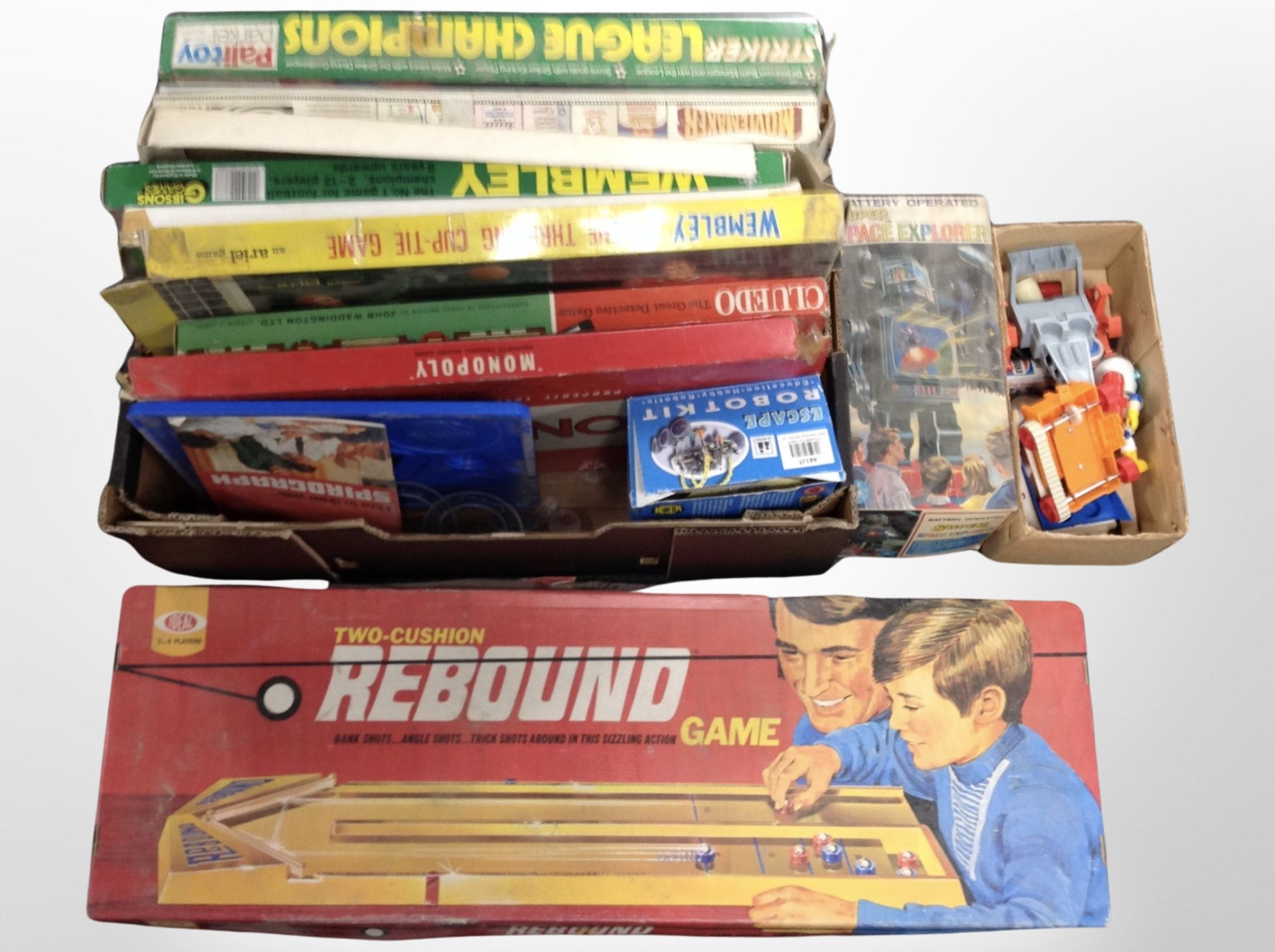 A box of vintage football-themed board games, other games,
