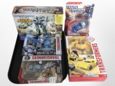 Five Hasbro Transformers figures, boxed.