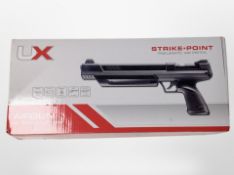 A Umarex Strike Point pneumatic air pistol, .22, in box with instructions, tin of pellets.