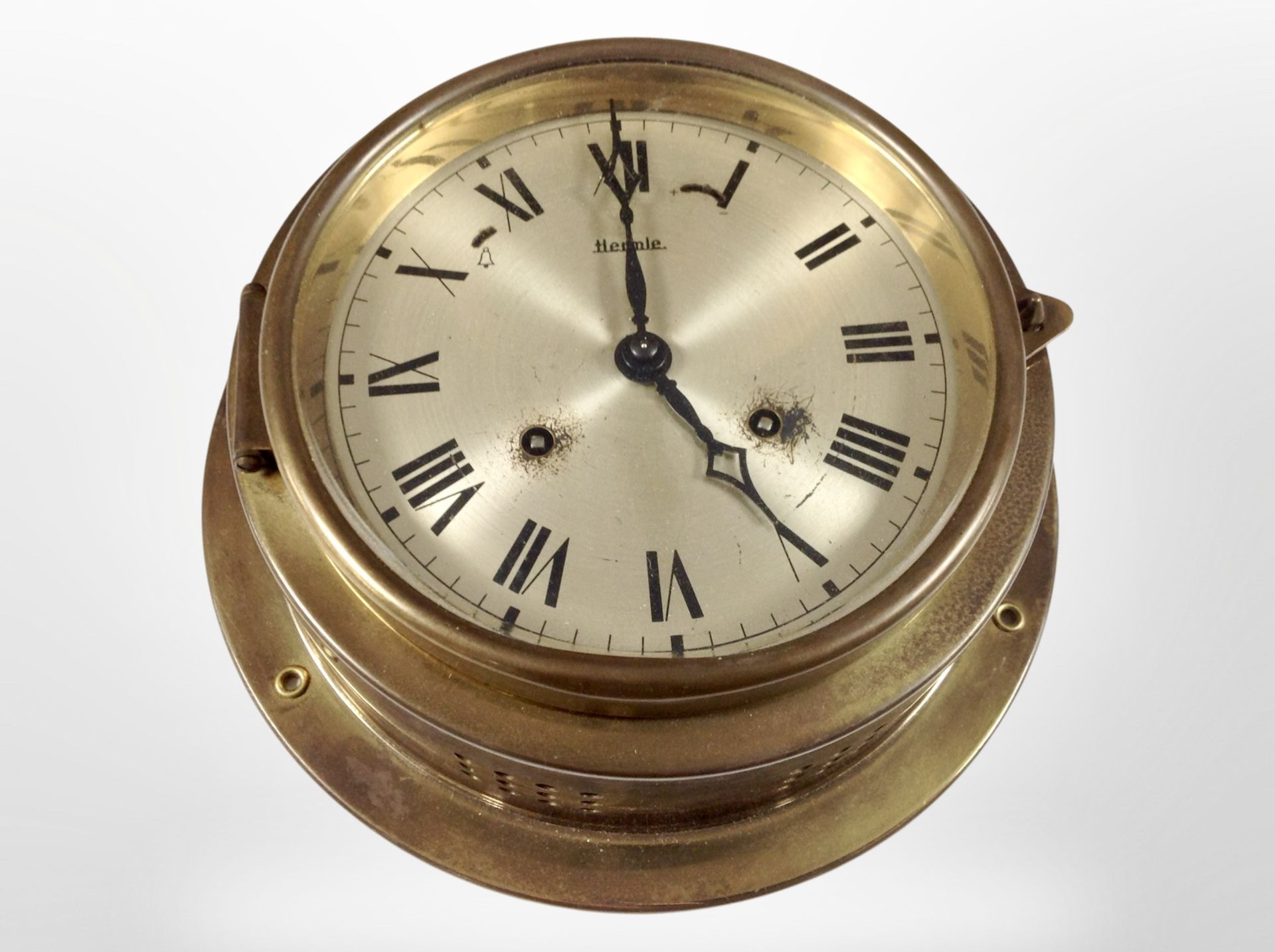 A Hermle brass-cased ship's circular timepiece, diameter 21.5cm.