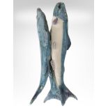 A studio pottery group of three fish, height 42cm.